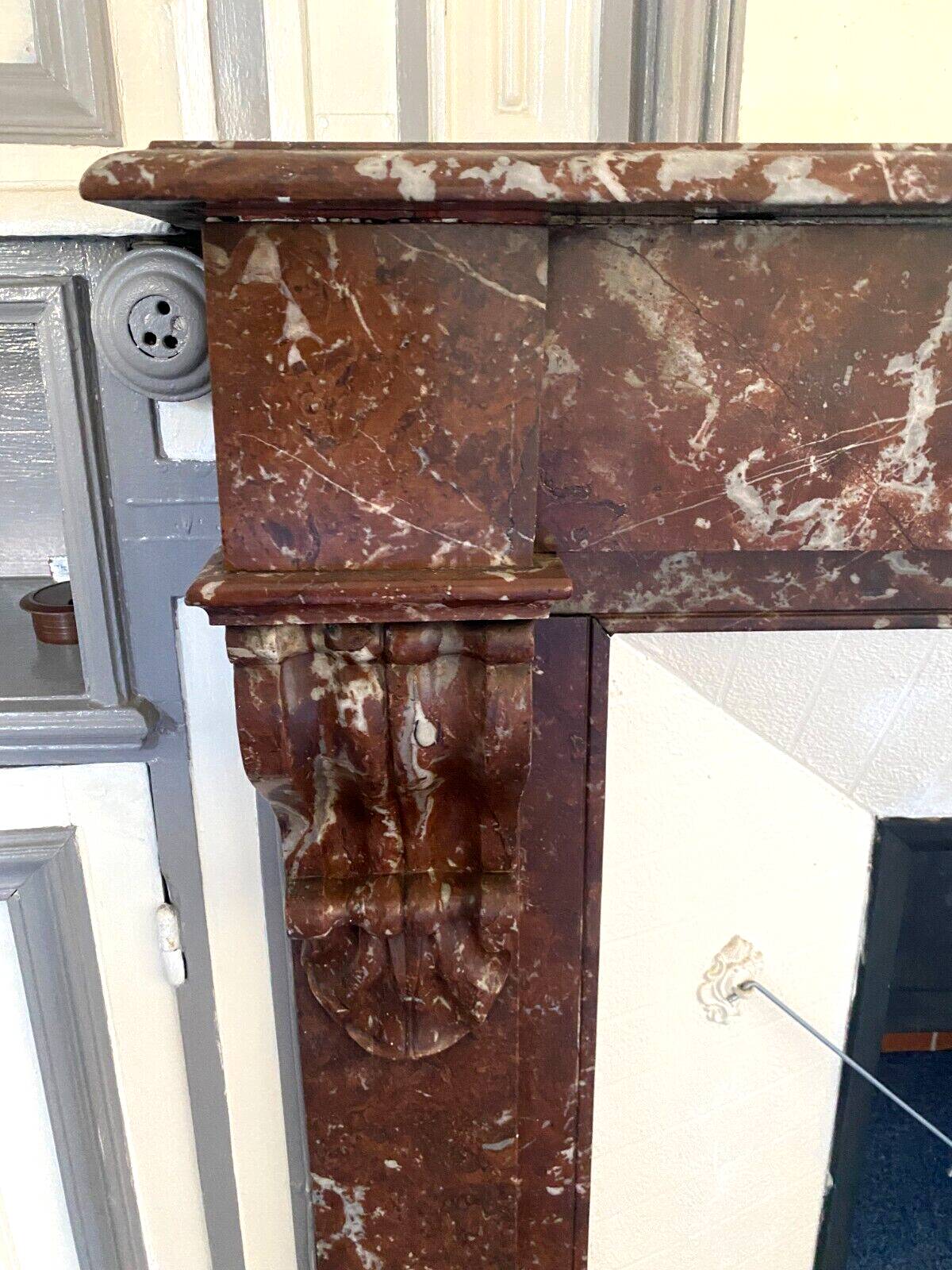 Louis Philippe style fireplace in speckled red marble 20th century