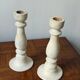 Pair of white wooden candlesticks