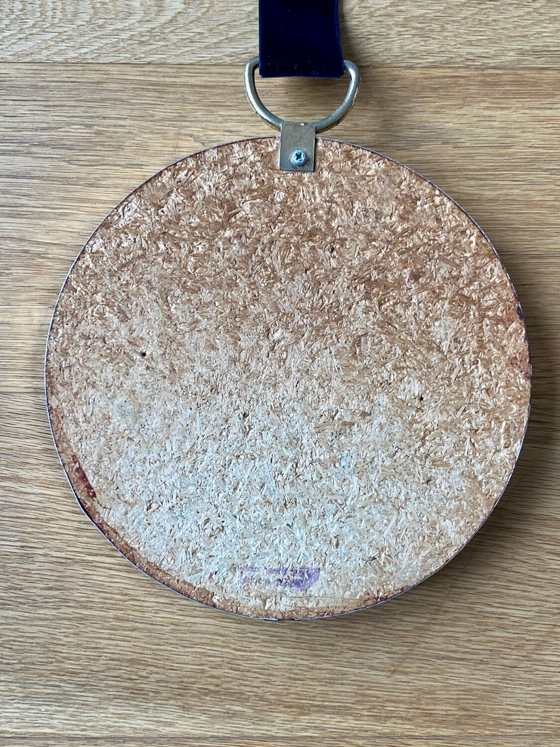 Vintage witch's eye curved mirror hangs velvet ribbon