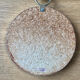 Vintage witch's eye curved mirror hangs velvet ribbon