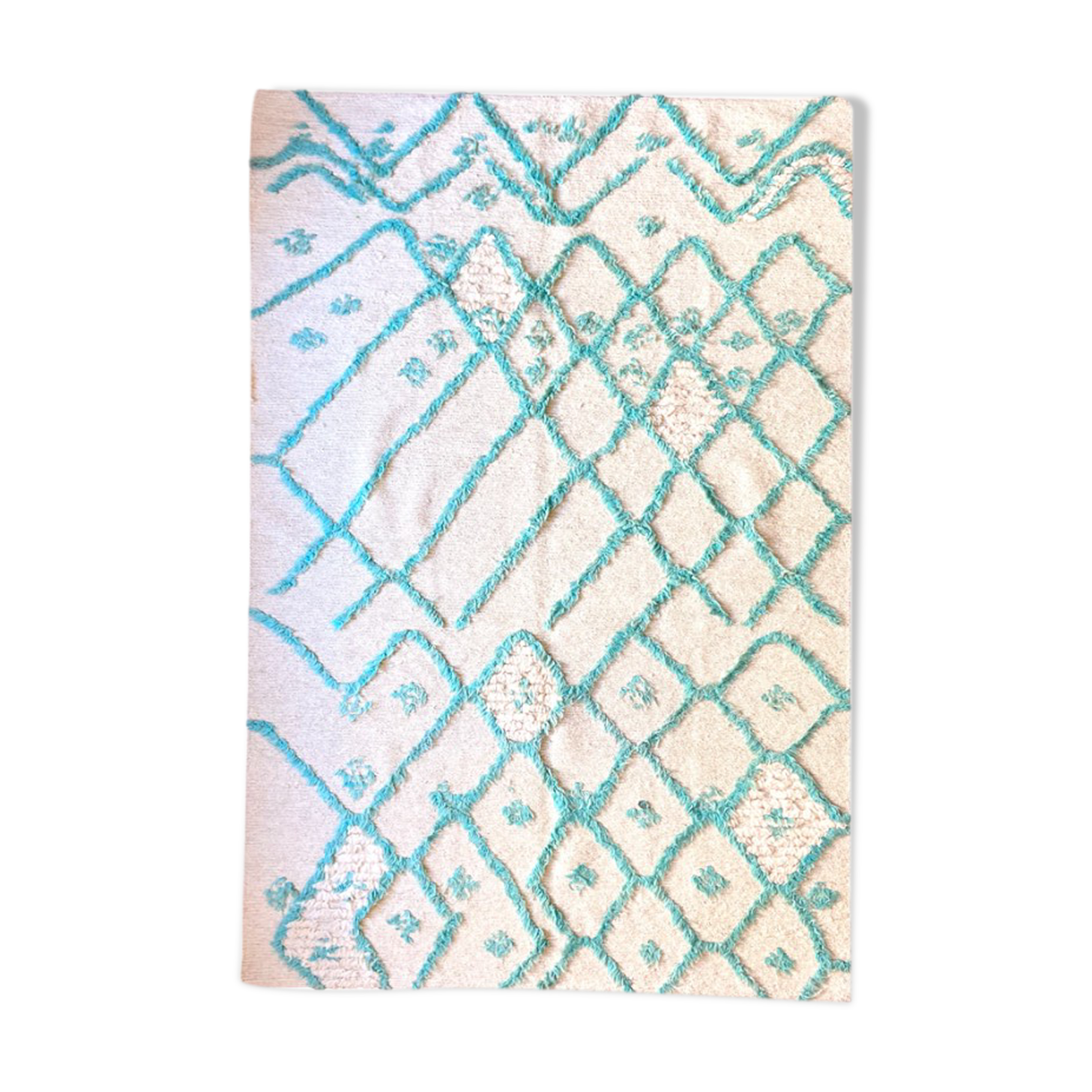 Berber cream carpet with blue pattern