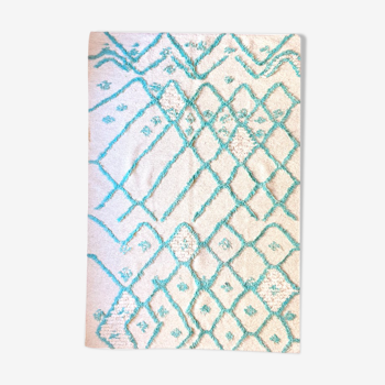 Berber cream carpet with blue pattern