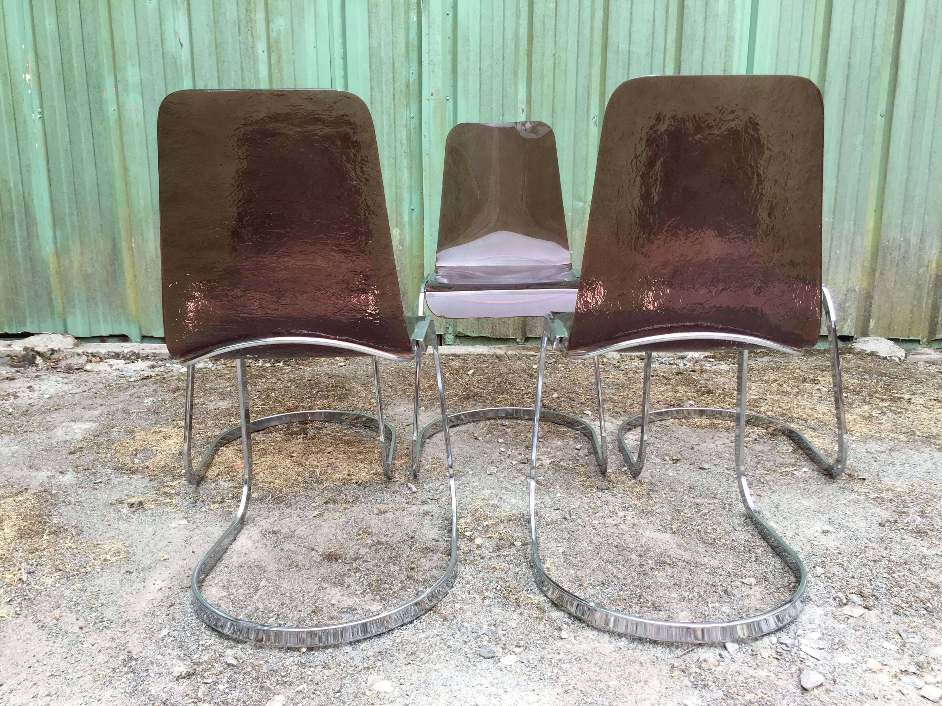 Chairs in plexiglas with chrome metal base