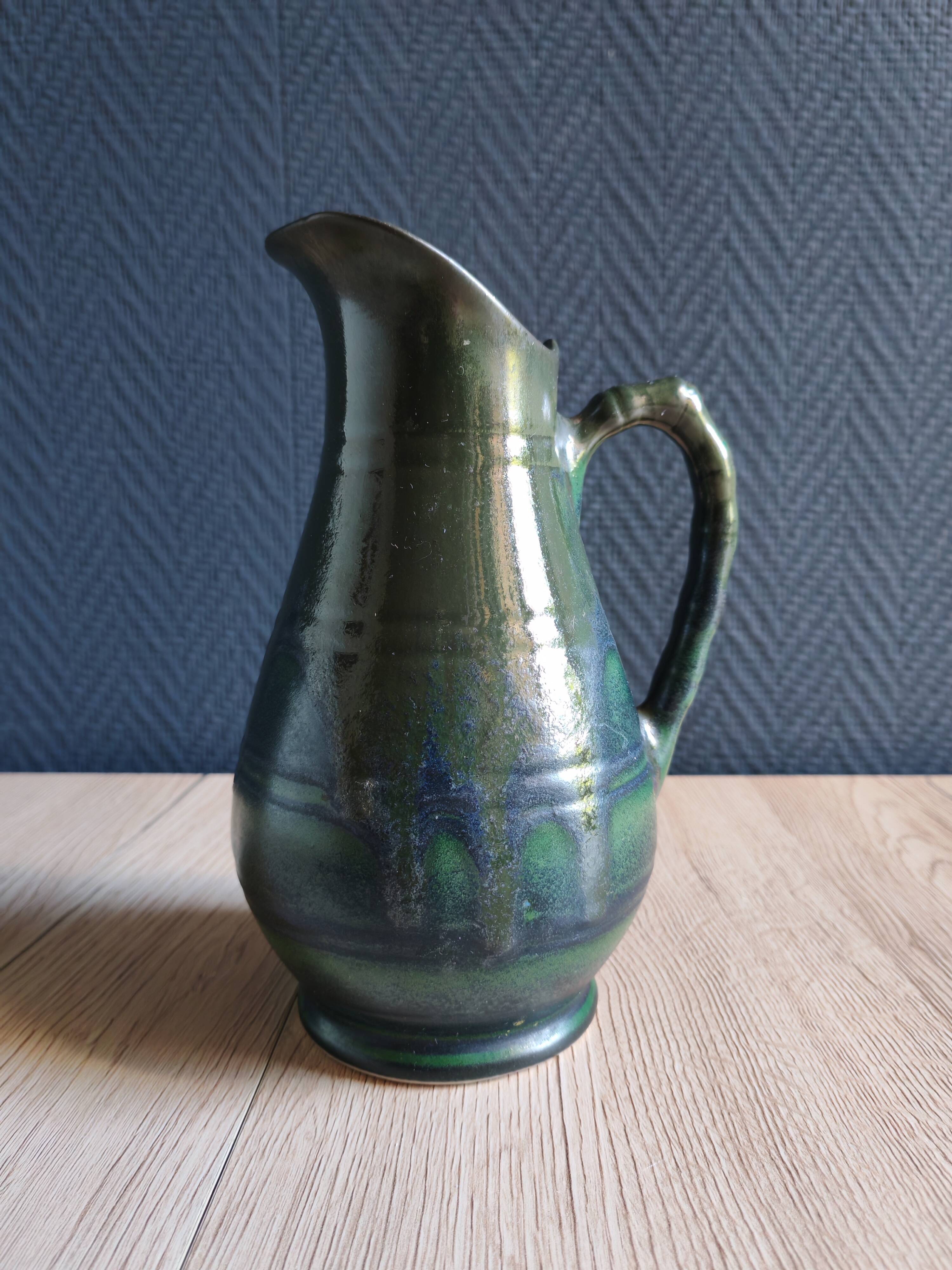 Vintage ceramic pitcher vase in glazed green and blue.