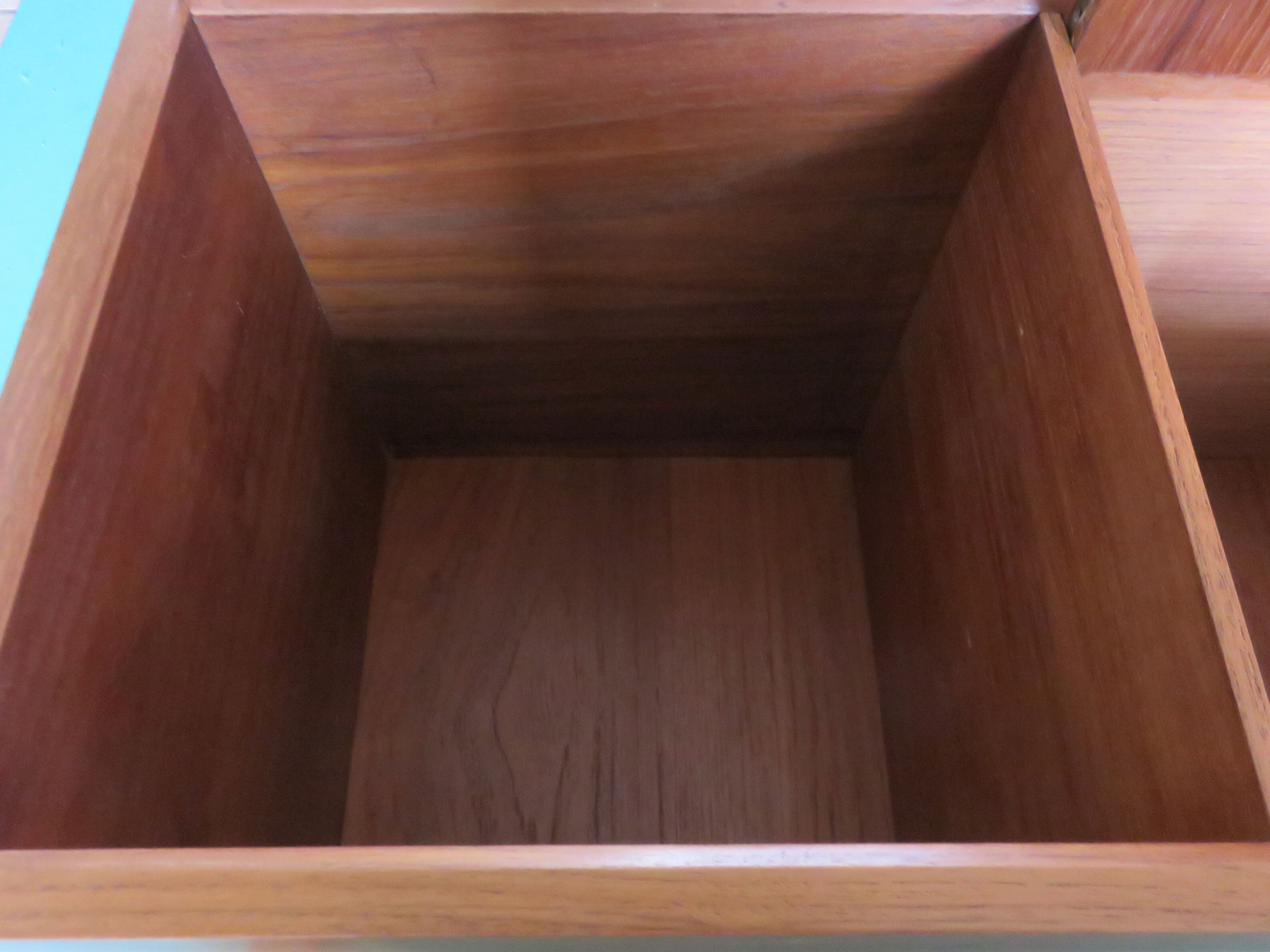 Wall shelving system and teak writing box. of Poul Cadovius. Denmark 1960