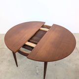 Round extendable wooden dining table