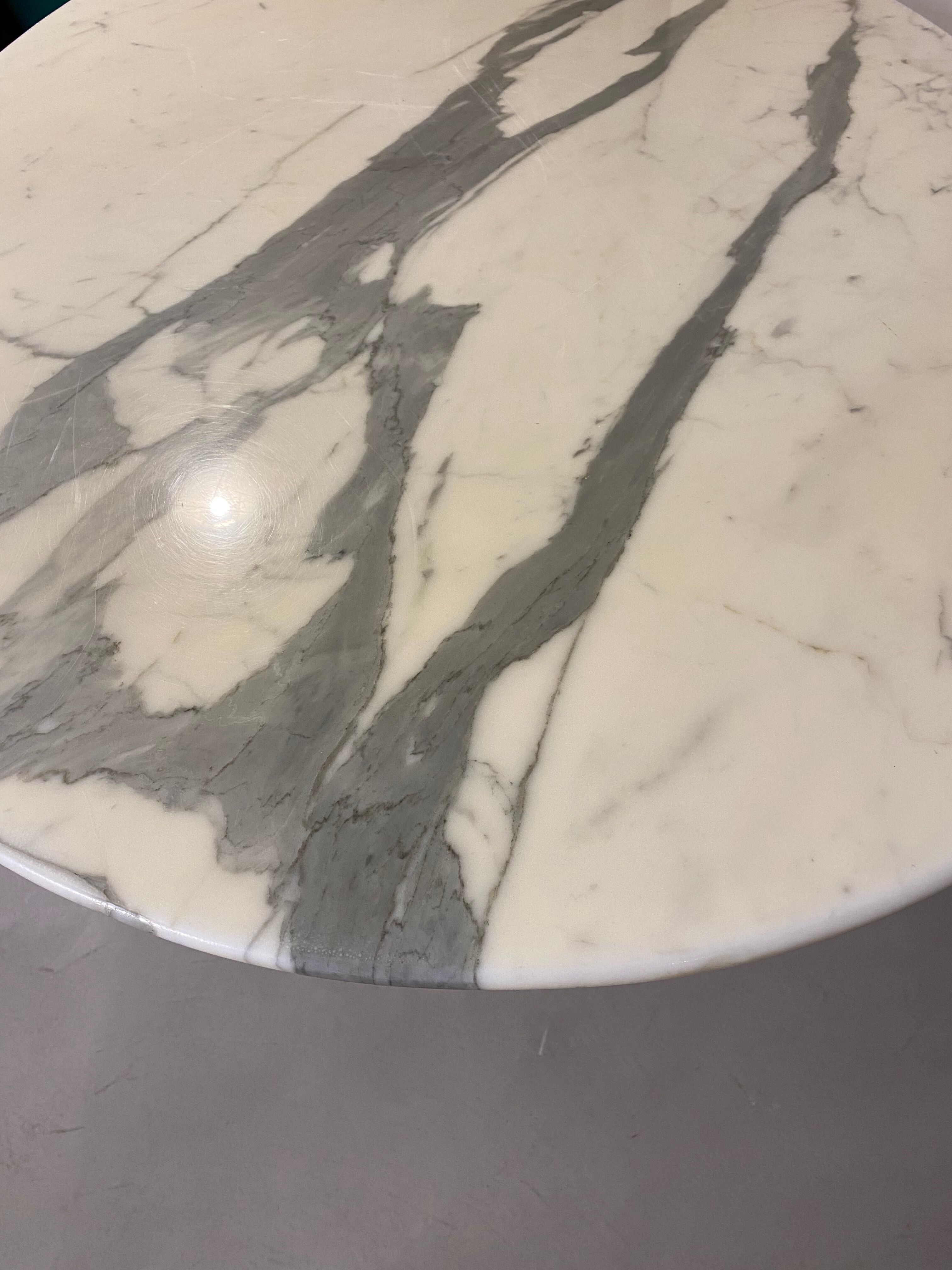 Oval marble dining table with iron base