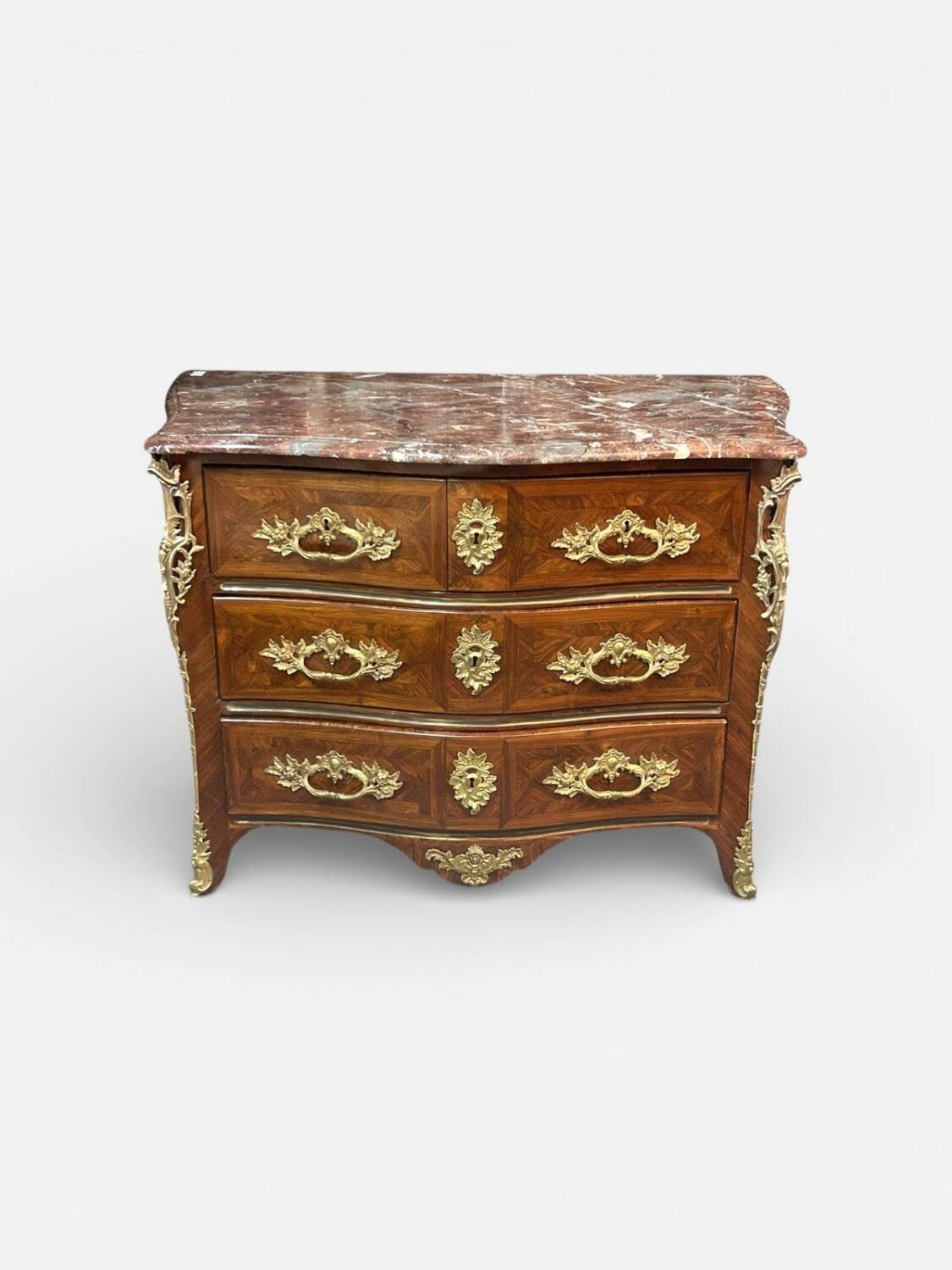 Louis XV period commode with violet wood veneer.