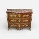 Louis XV period commode with violet wood veneer.