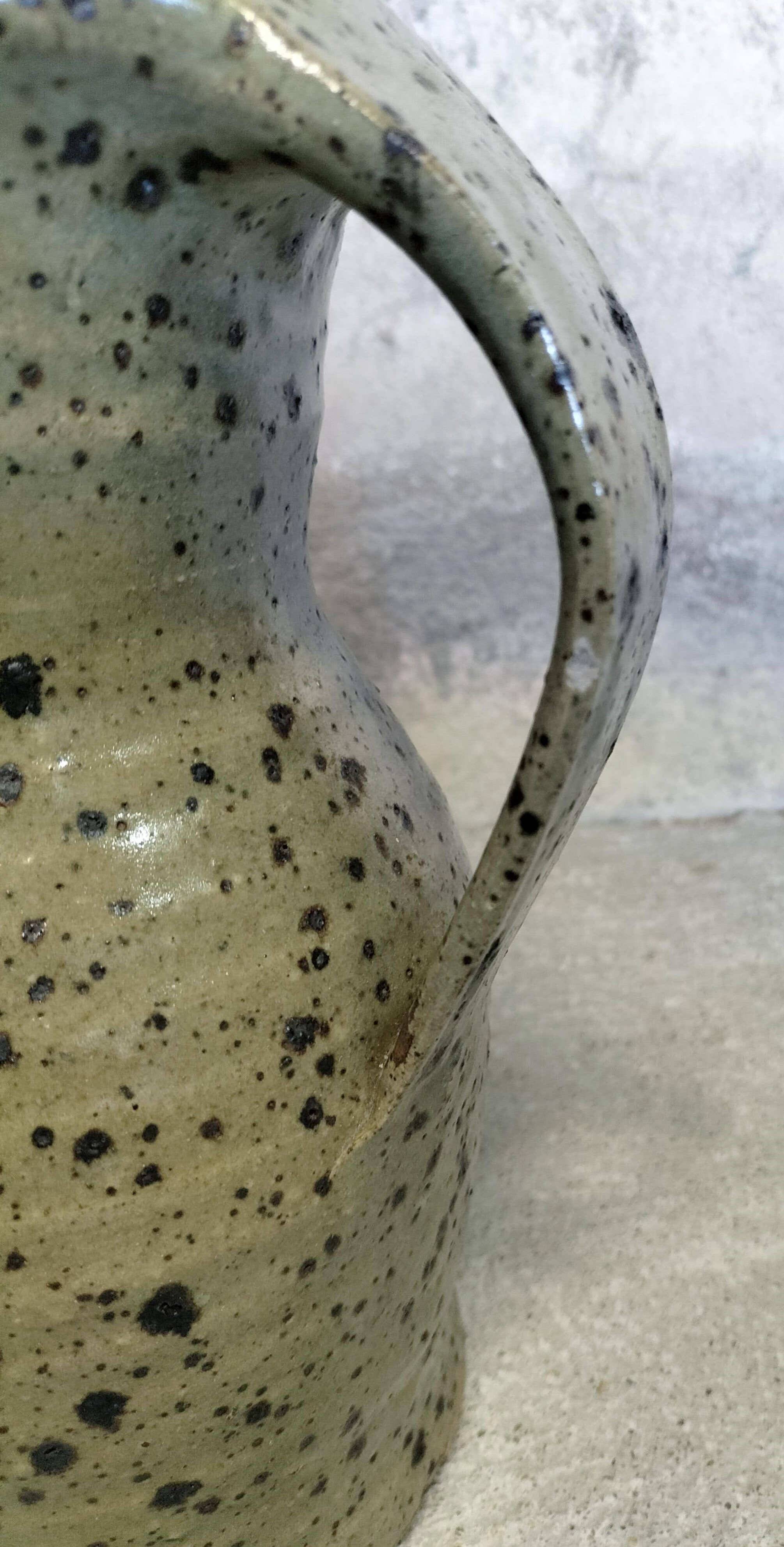 Stoneware pitcher by Gustave Tiffoche