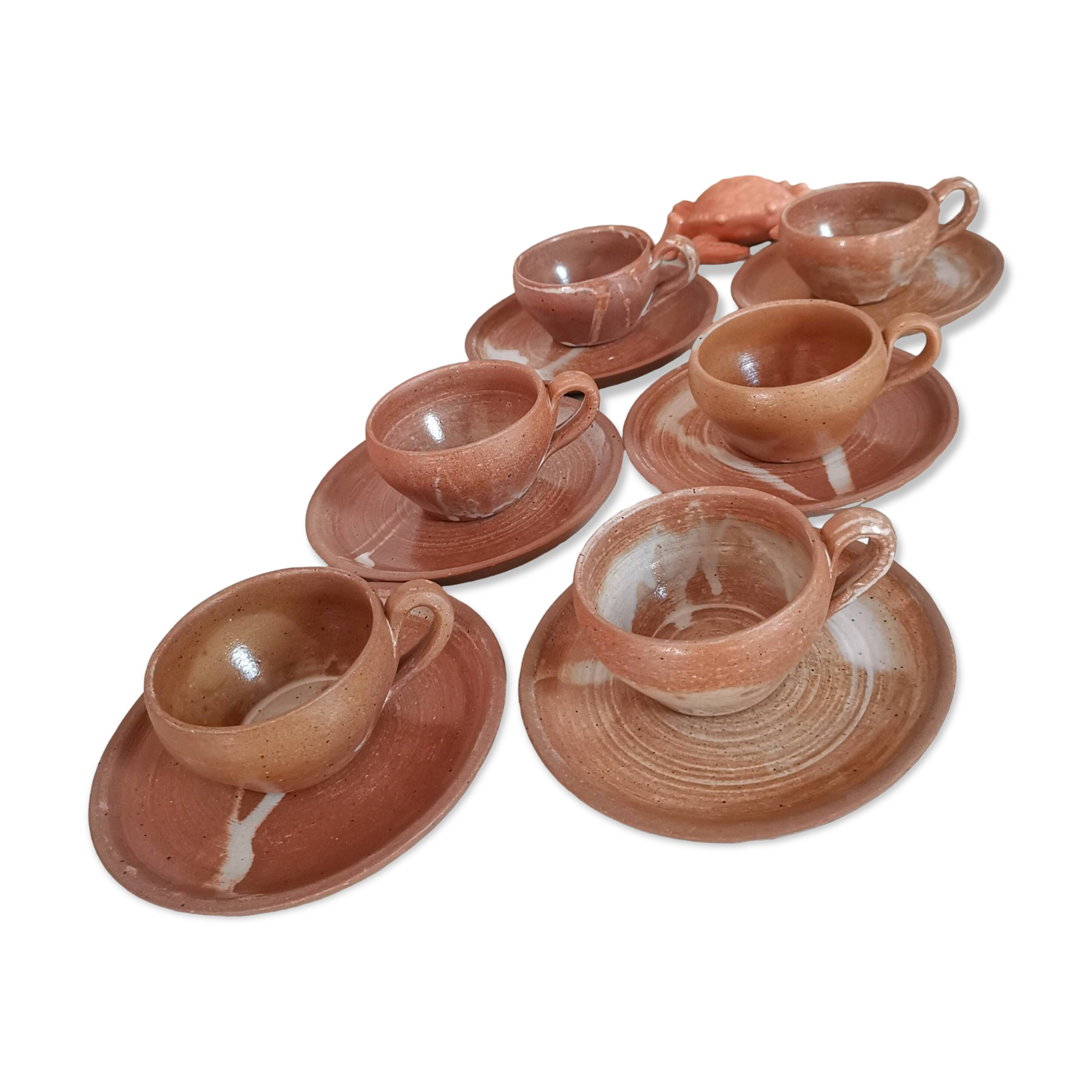 Set of vintage stoneware cups and saucers