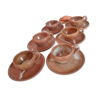 Set of vintage stoneware cups and saucers