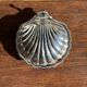 Vintage silver-plated shell butter dish with blue bowl.