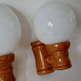 Pair of globe wall lights in pine and opaline from the 60s