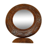 Antique mirror on wooden stand and metal net