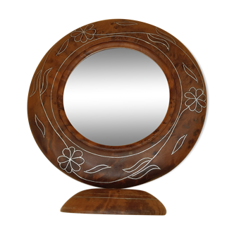 Antique mirror on wooden stand and metal net
