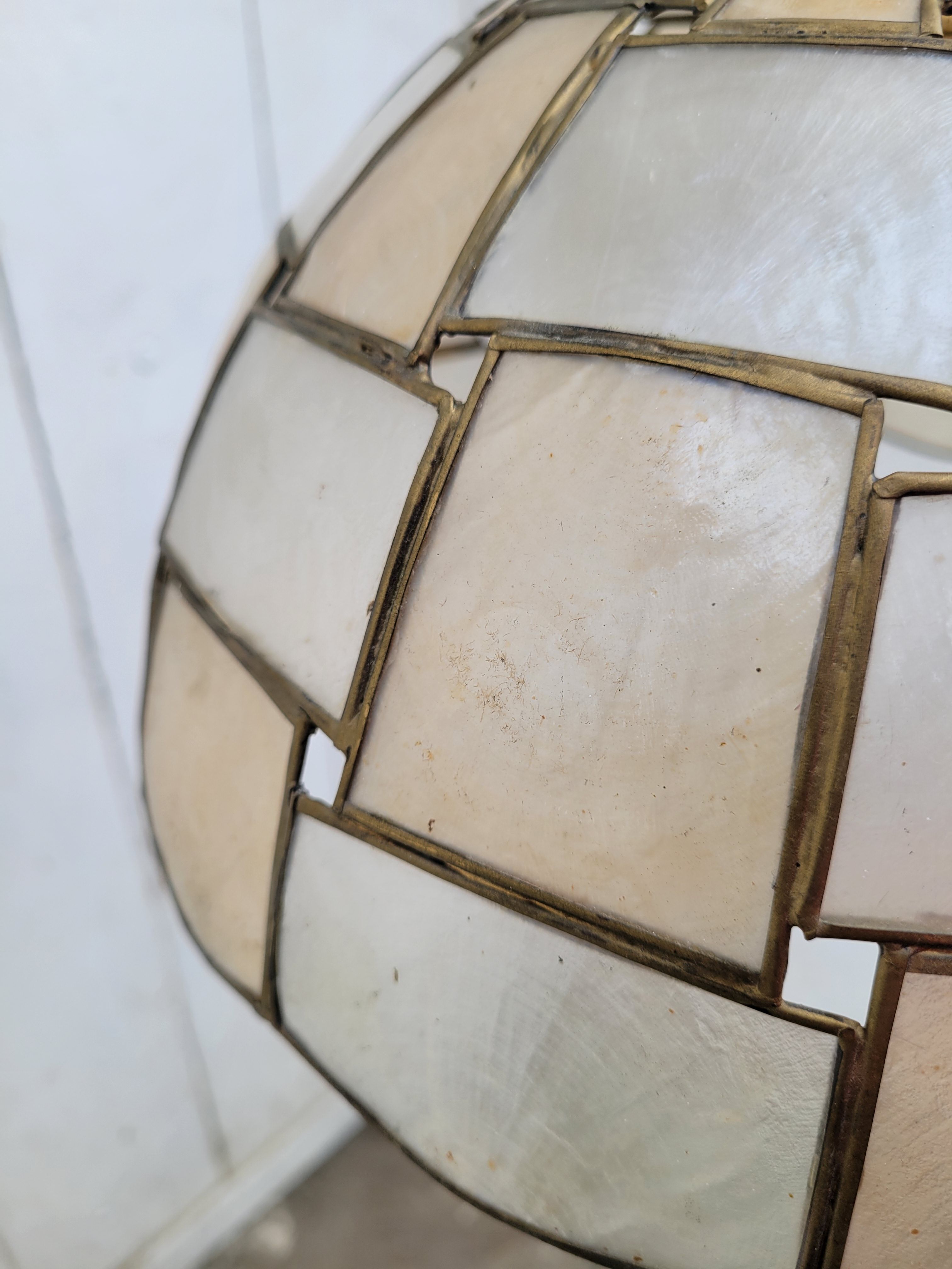 Suspension in mother-of-pearl and brass