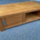 Solid wood coffee table with sliding door, stained pine, 120x60cm.