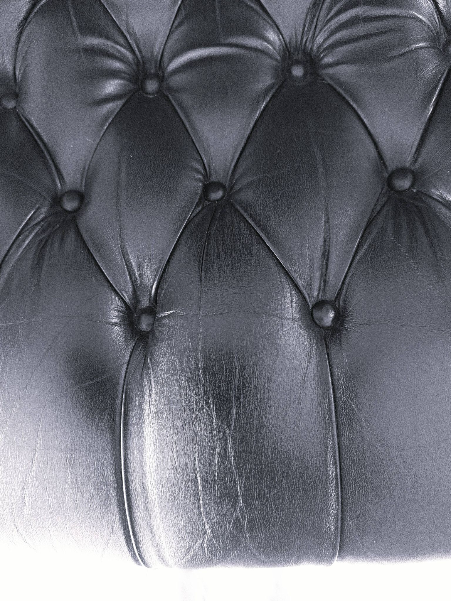 Black leather rocking Chesterfield armchair