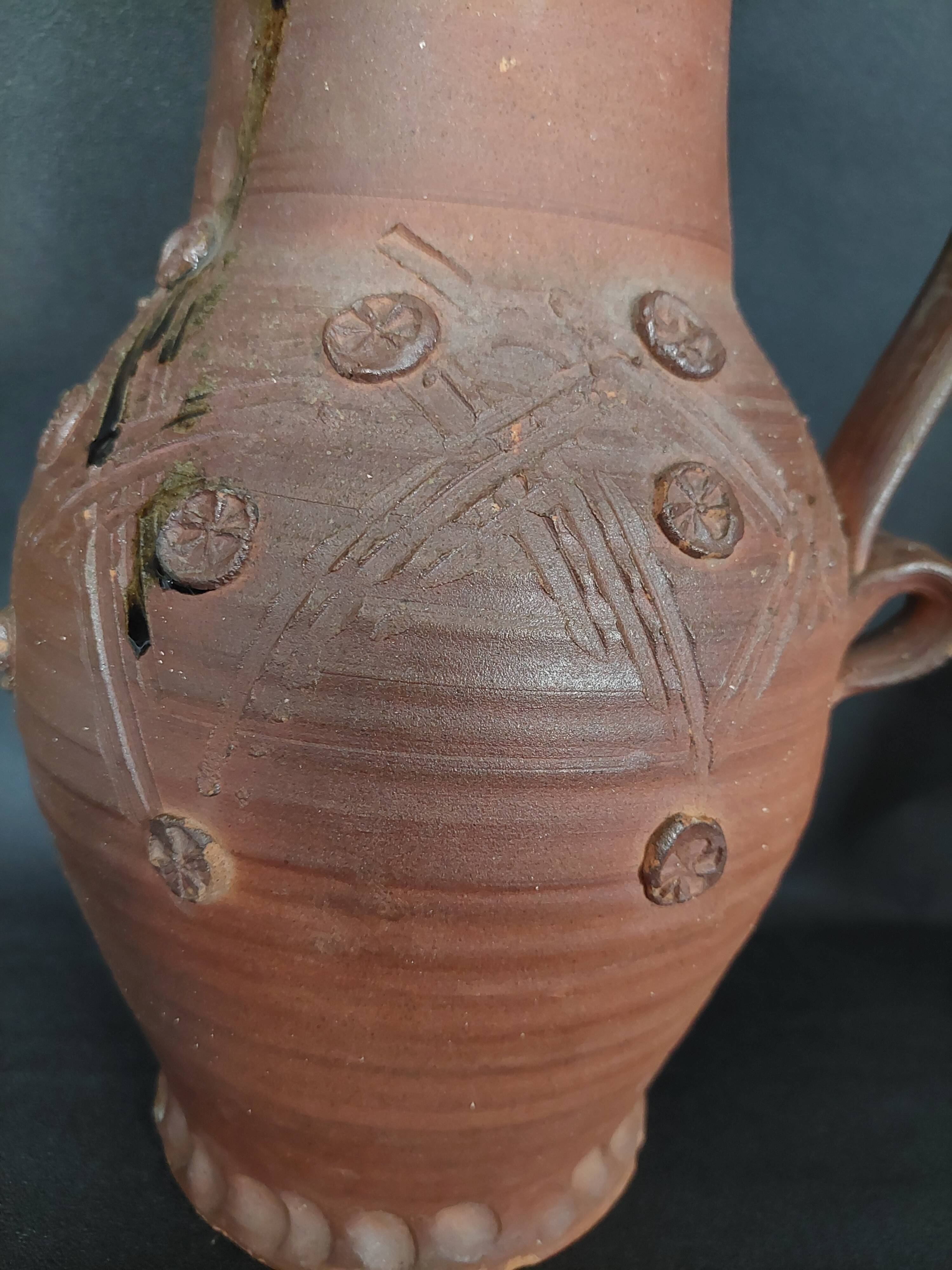 Vintage pitcher with a signature to identify.