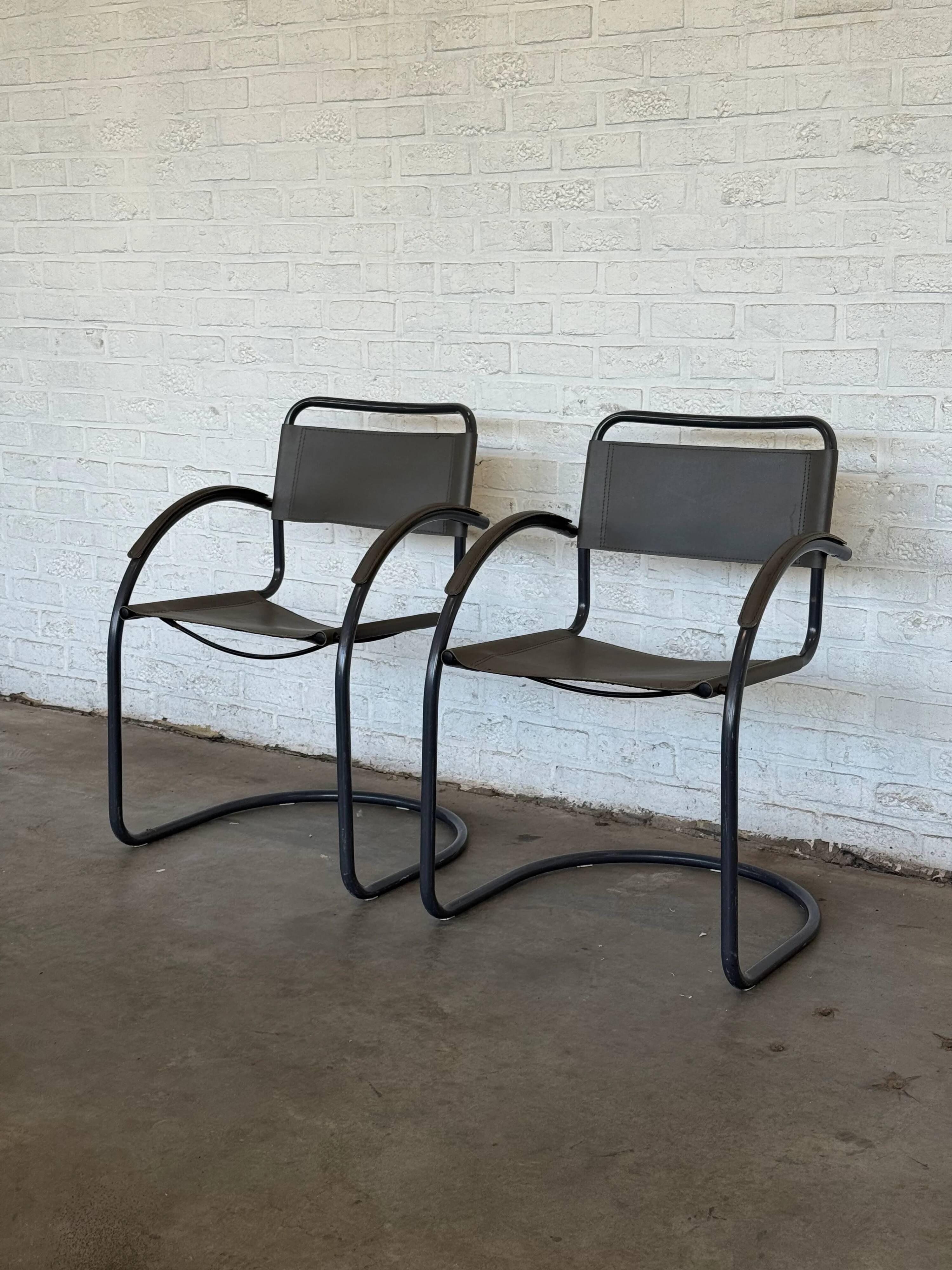 Vintage cantilever lounge chairs — pair, grey leather and tubular steel