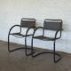 Vintage cantilever lounge chairs — pair, grey leather and tubular steel