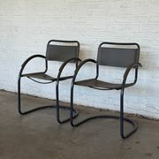 Vintage cantilever lounge chairs — pair, grey leather and tubular steel