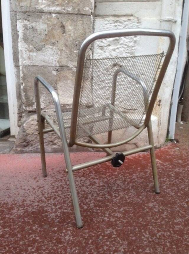 Vintage armchair in ribbed fabric and chrome steel from the 1940s France