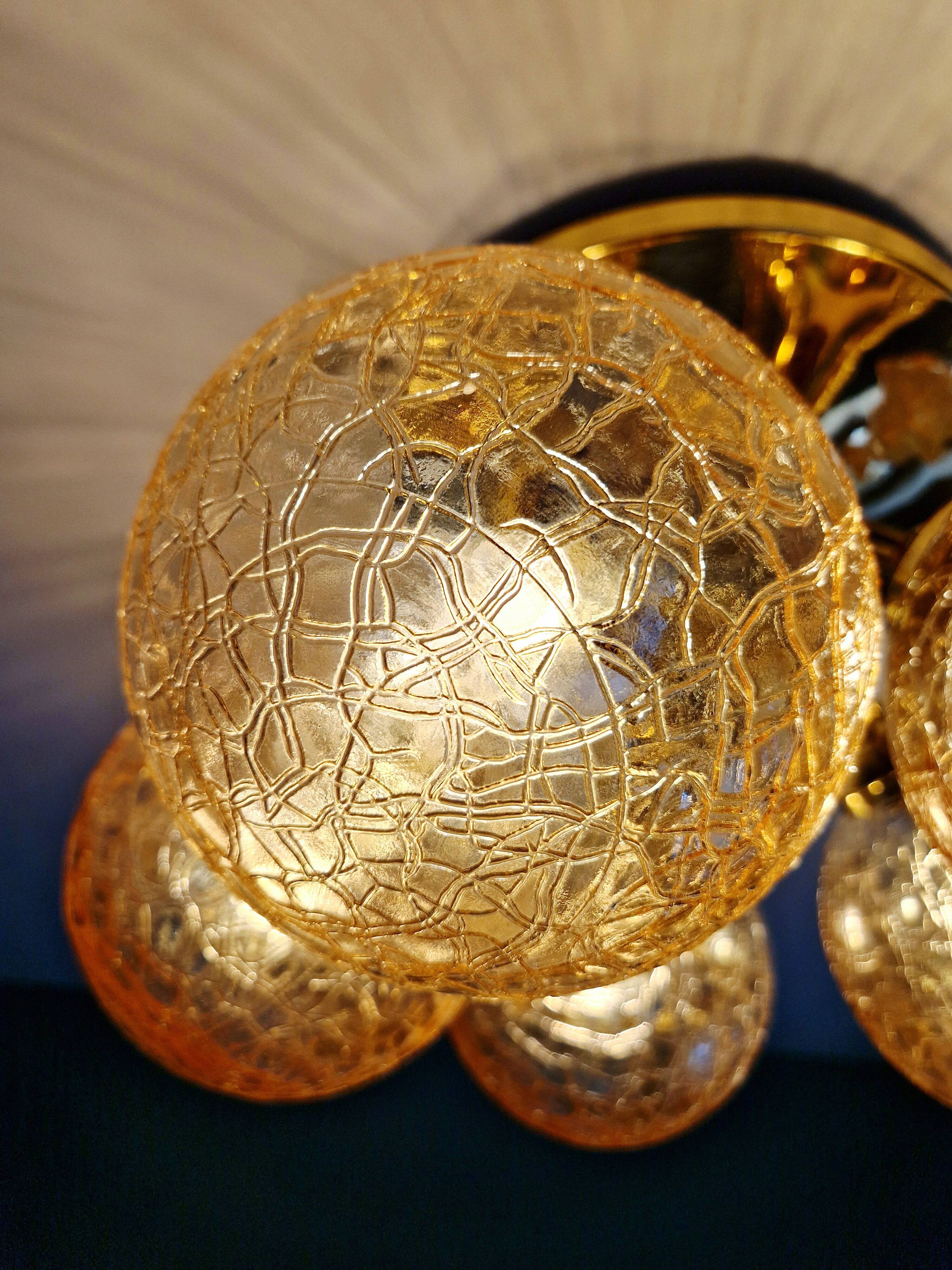 Large designer ceiling light in brass and amber crackled glass, 1970s.