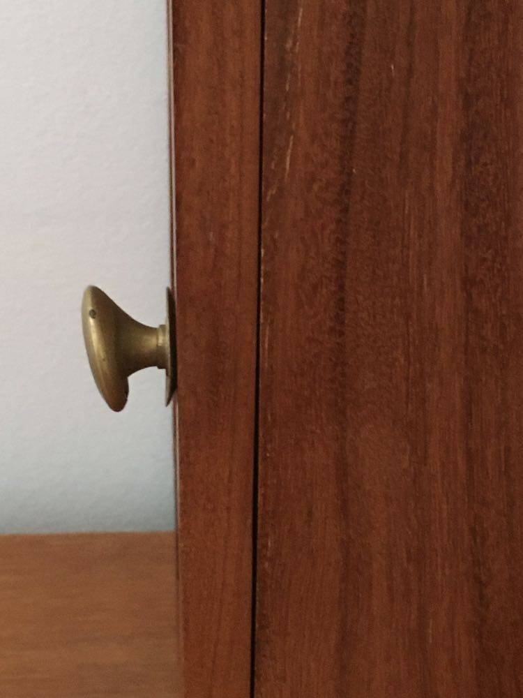 Key box in wood and brass and central motif representing a sailor's anchor