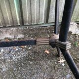 Vintage bistro table with an Art Deco style cast iron base and Formica top.