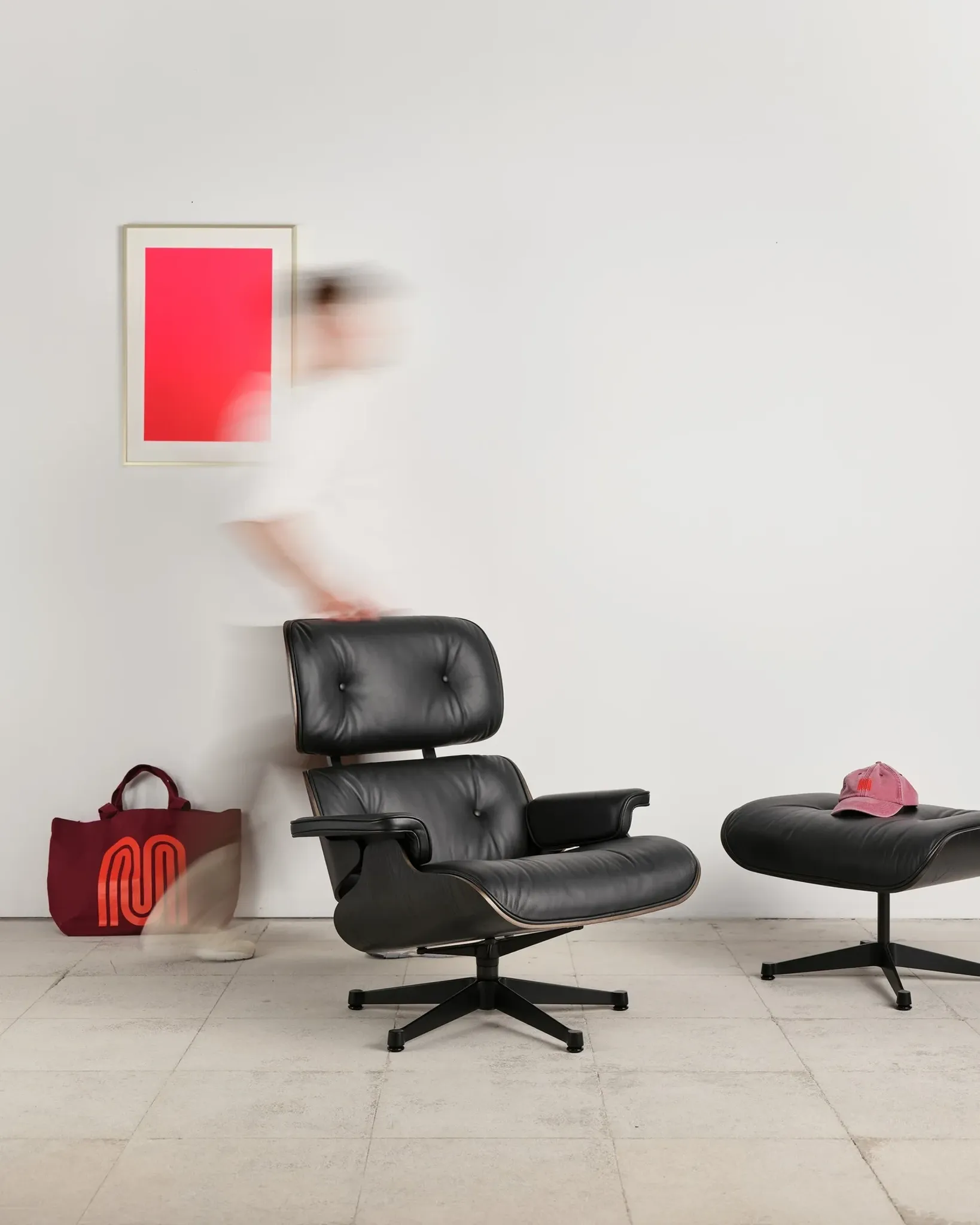 Lounge Chair and ottoman in black leather by Charles & Ray Eames, Vitra