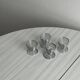 Set of 4 designer egg cups in shiny silver metal