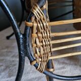 Small antique piece of furniture from the 1960s made of rattan and wrought iron in the shape of a lyre.