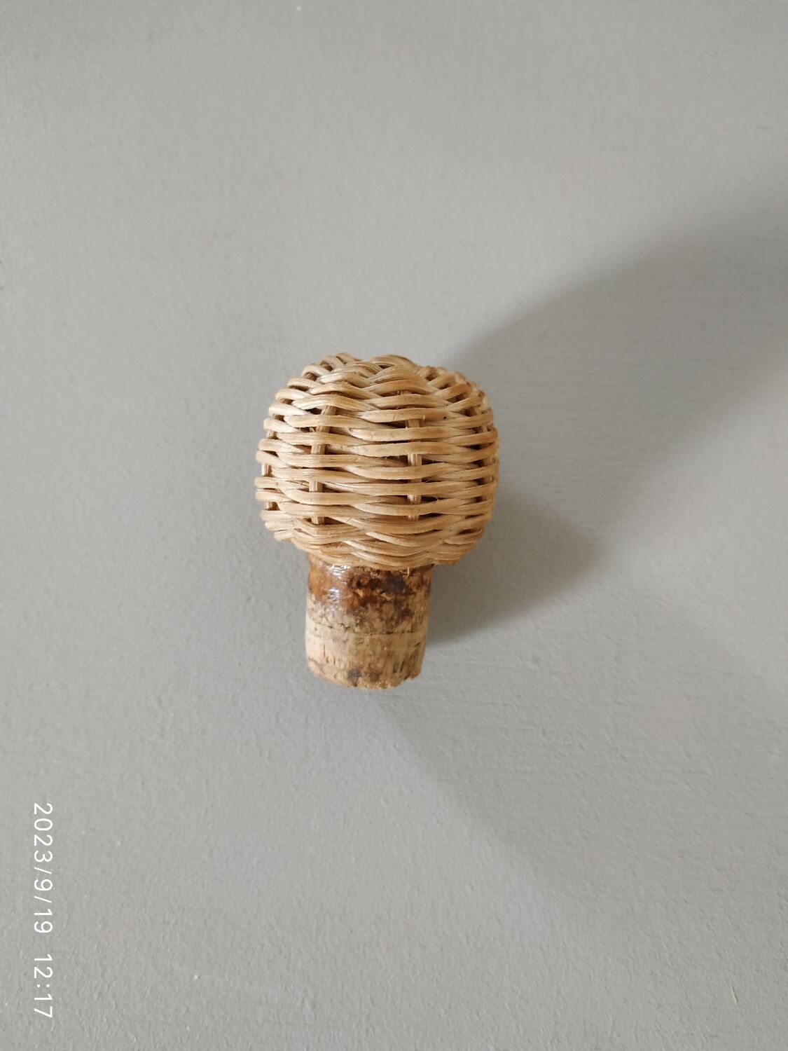 Glass and rattan bottle