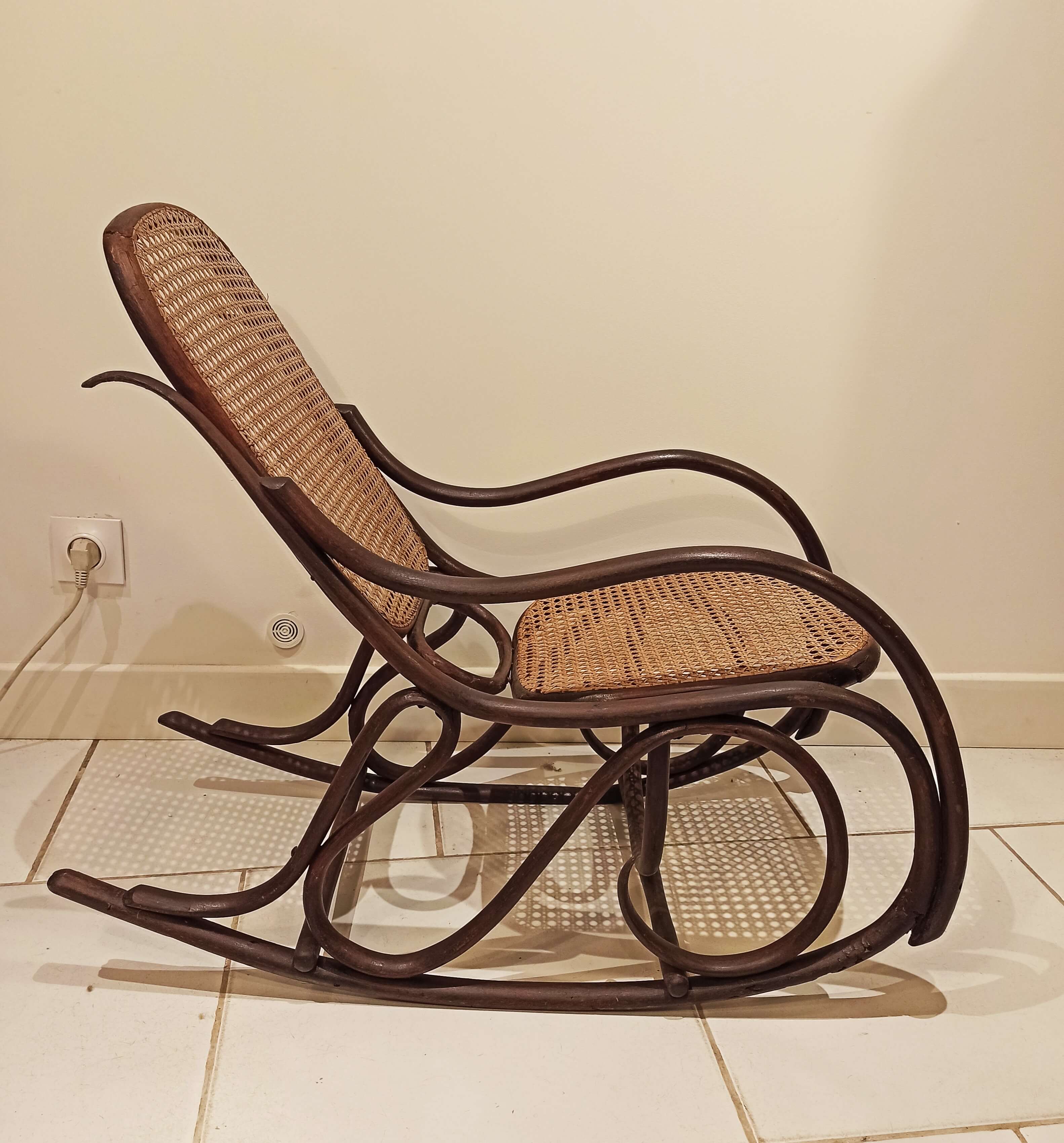 Vintage rocking chair for children in dark rattan and canework, rocking chair