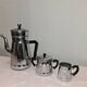 coffee maker, sugar bowl and iron milk jar