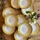 Set of 12 vintage yellow, white and gold soup plates
