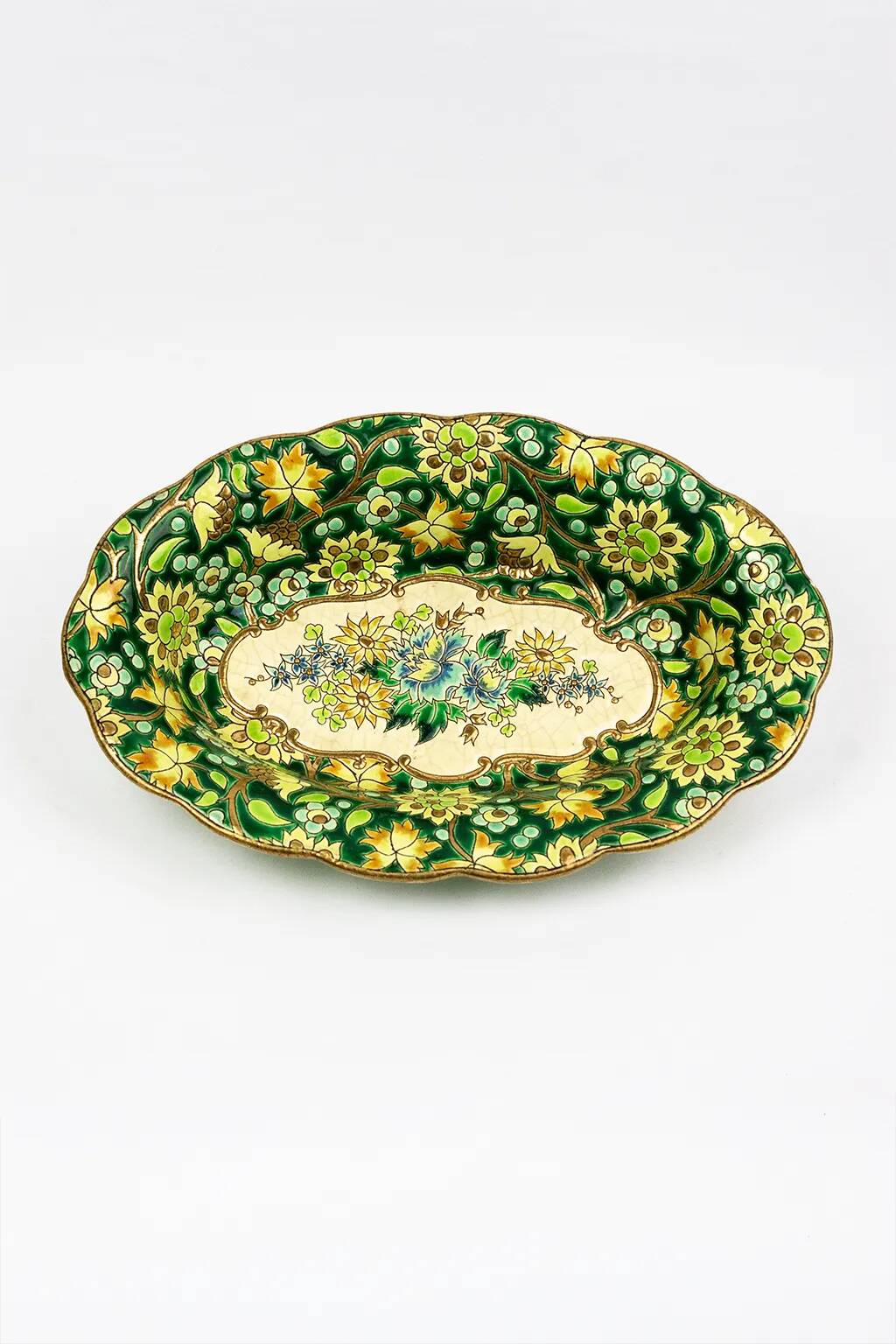 Longwy cup in cloisonné enamels on a green background, polychrome floral decoration and gold