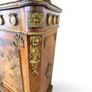 An antique French Louis XVI-style marble-top side cabinet