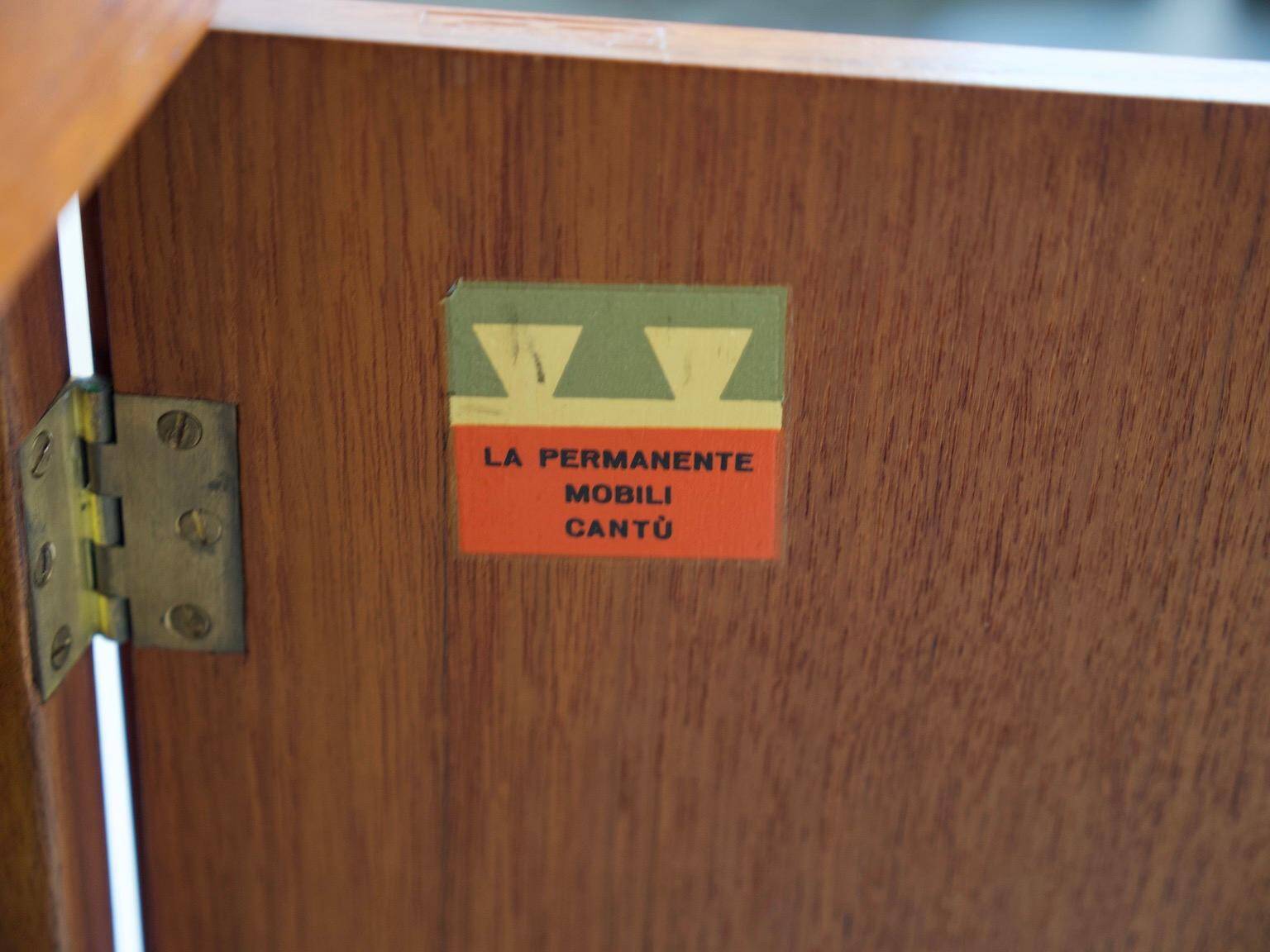 Modern mid-century teak sideboard with brass details.