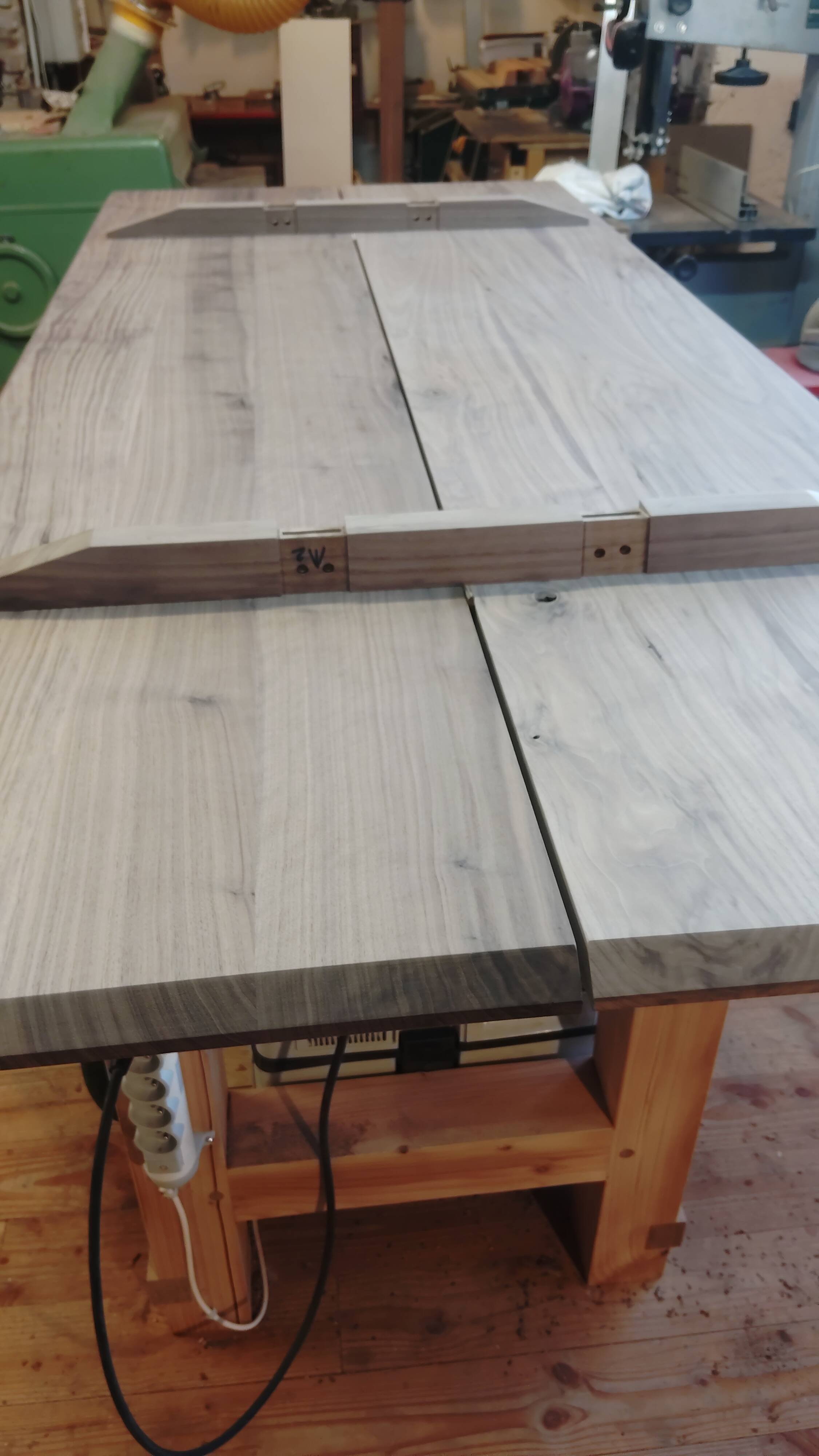 Exceptional dining table in solid walnut.