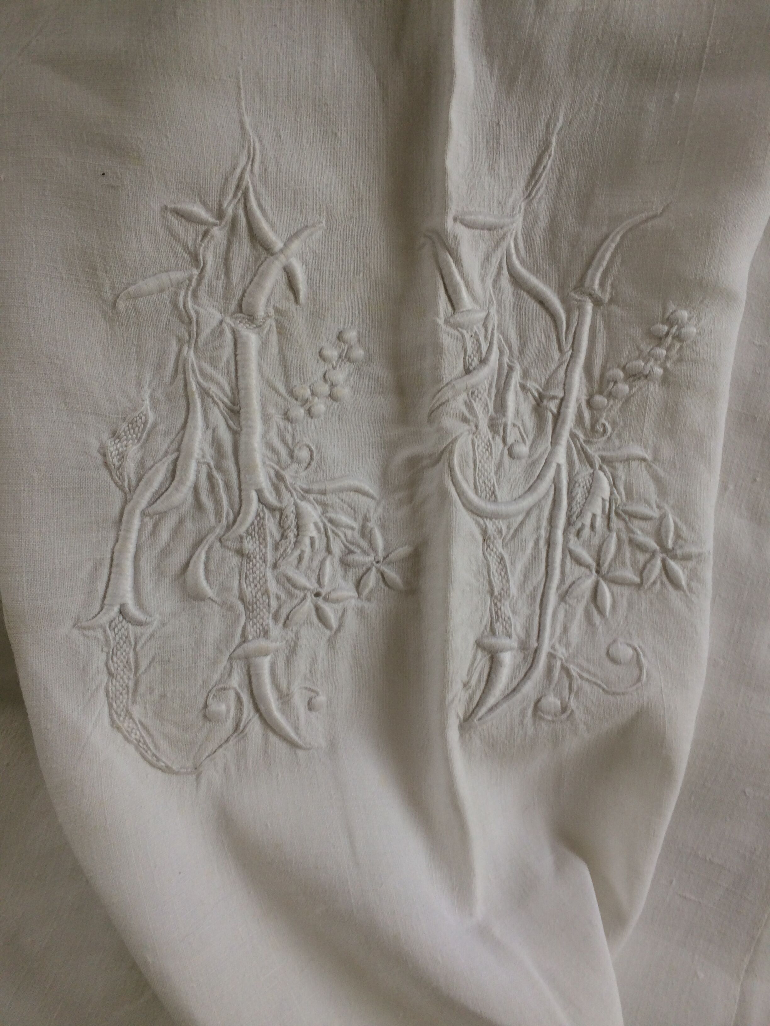 Antique linen sheet with days, embroideries and monograms worked