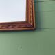 Antique mirror in carved wood and mercury 48x63cm