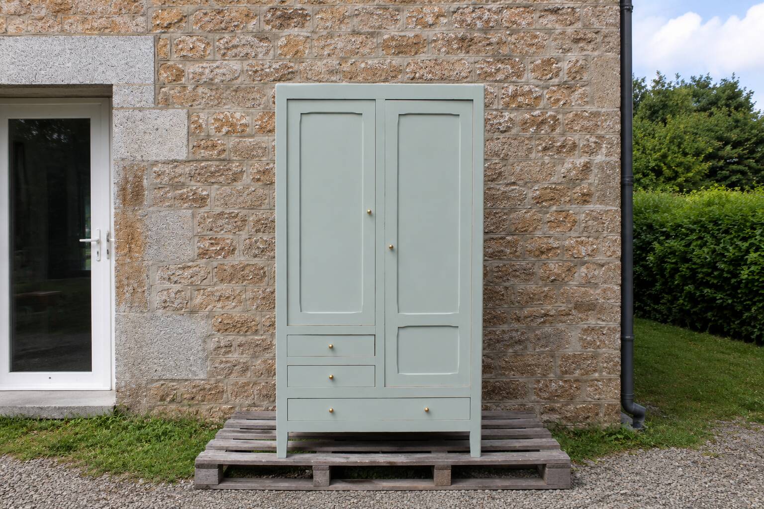 Vintage Parisian wardrobe in muted sage green.