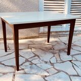 Vintage oak farmhouse table with a white top.