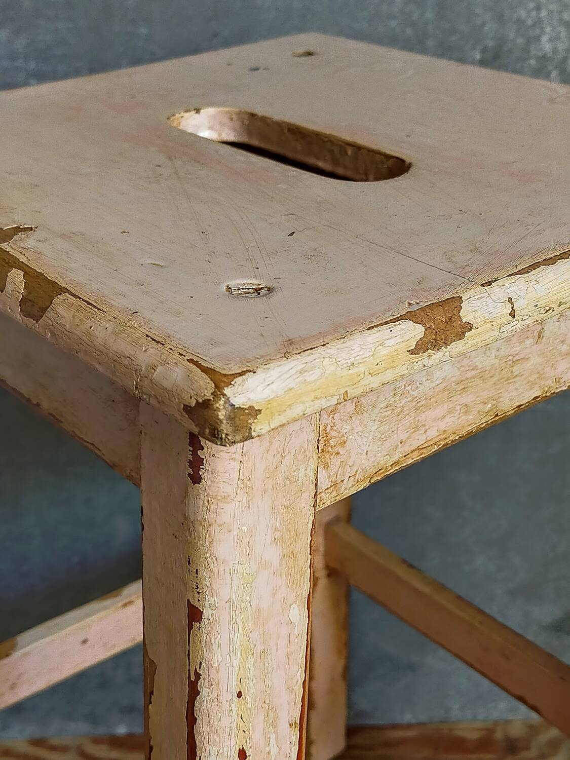 Antique workshop stool in patinated solid wood