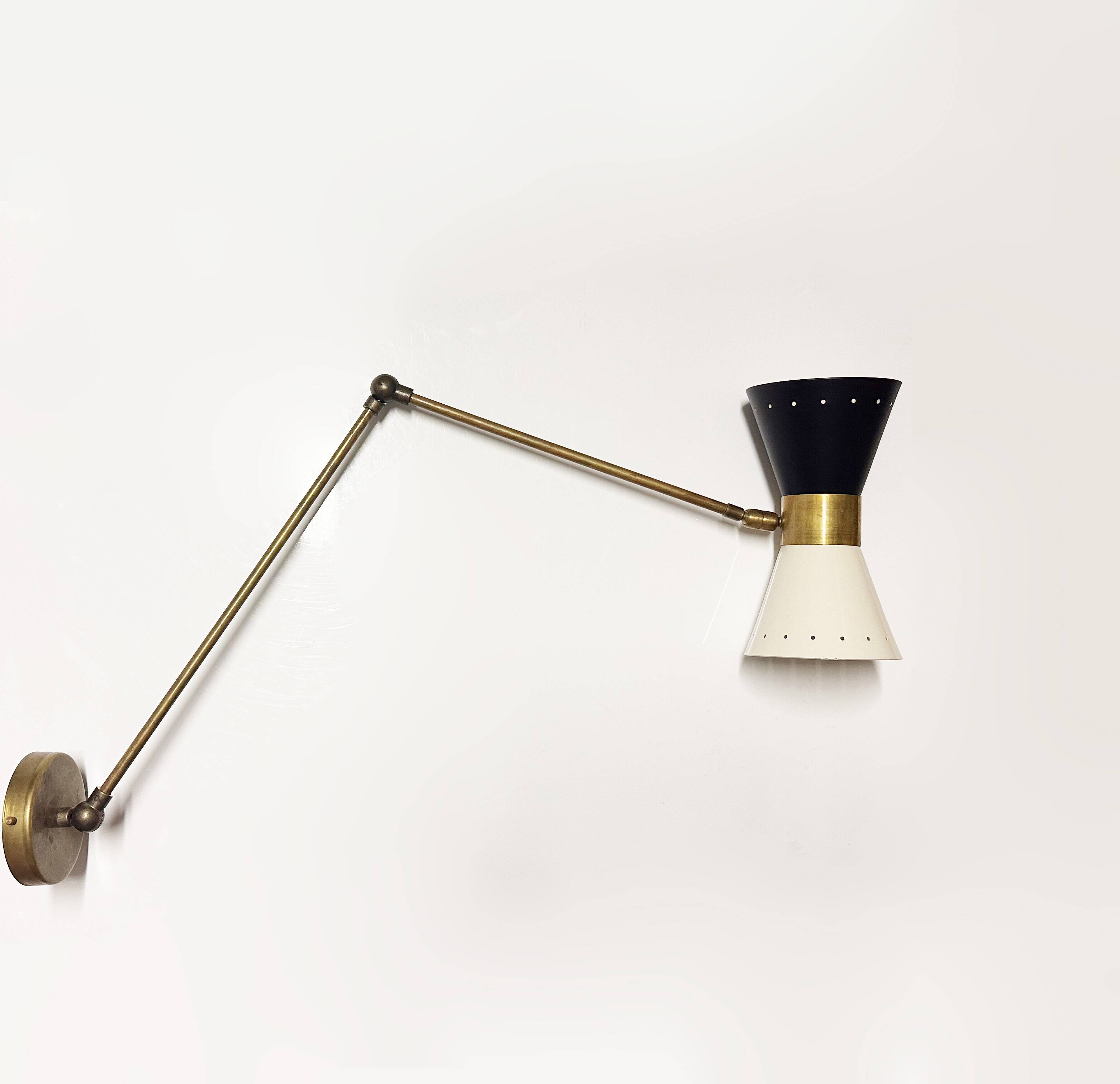 Articulated brass and lacquered iron wall light, 1950s design.