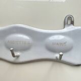 Enamelled sheet metal with inscriptions and hooks