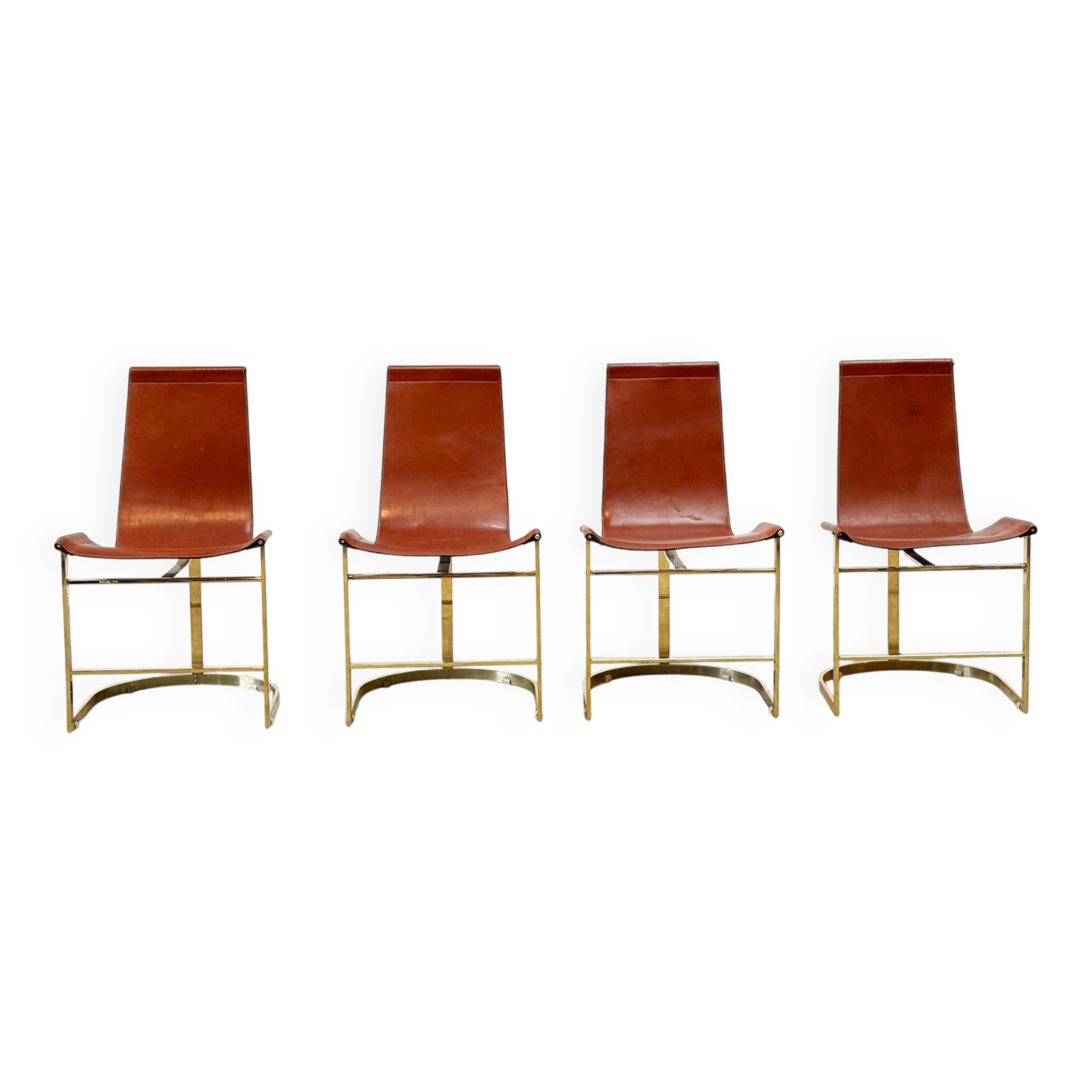 Set of four leather and brass Italian dining chairs